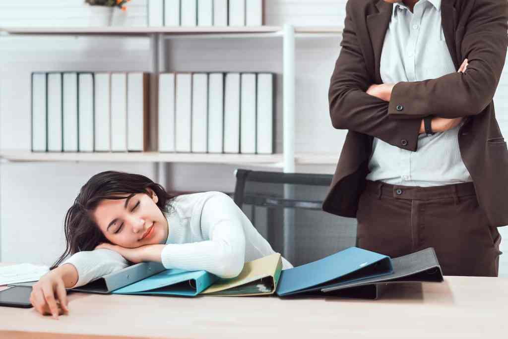 boss with productivity paranoia watching worker slack off in the office unproductive